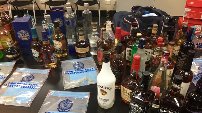 Detectives seized luxury vehicles, including a Mercedes AMG, about $100,000 cash, amphetamine, cocaine, cannabis, certified gold playing cards, alcohol and designer clothing and shoes, which are believed to have been stolen in this morning’s raids. Picture: NSW Police