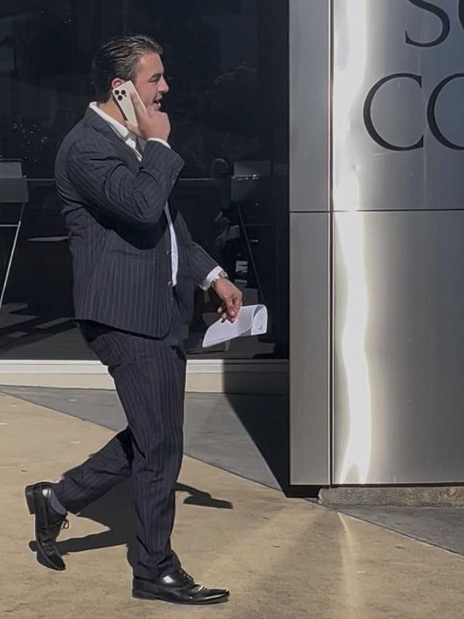 Pyke-Nott on the phone as he left Southport Courthouse. Picture: Emily Walker