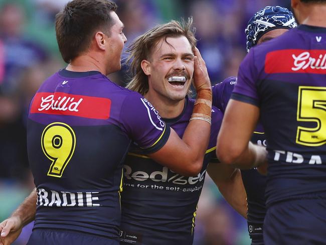 MELBOURNE, AUSTRALIA - MAY 11: Ryan Papenhuyzen of the Storm celebrates with teammates after scoring a try during the round 10 NRL match between Melbourne Storm and Wests Tigers at AAMI Park, on May 11, 2025, in Melbourne, Australia. (Photo by Mike Owen/Getty Images)