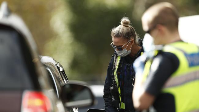 Police speak with drivers during Victoria’s stay-at-home orders. Picture: Daniel Pockett/Getty Images