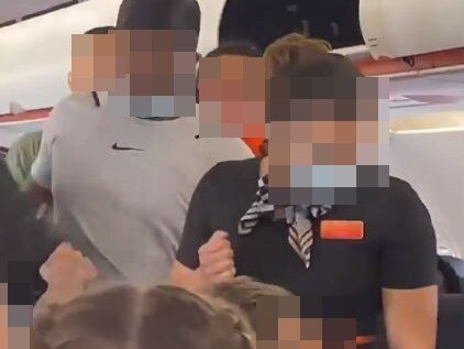 Easyjet passengers stage mutiny after armed police try to evict two black men – and force airline to replace cabin crew