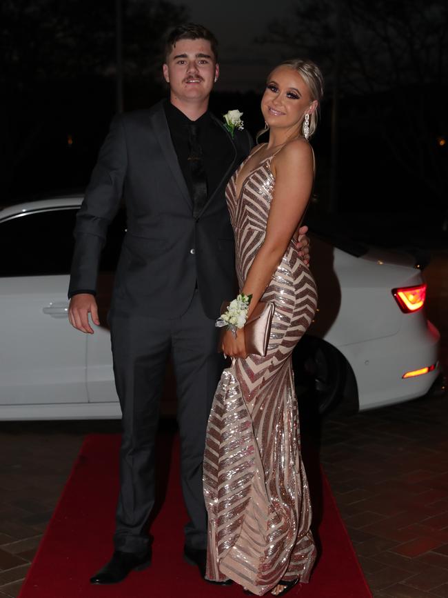 Ashton Tyrrell, 17, and Lauryn Garrett Mitchell, 18, at the Ormeau Woods School formal at Links Resort, Hope Island. Picture: Glenn Hampson