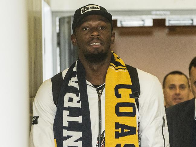 Usain Bolt arrives draped in a Central Coast Mariners scarf. Picture: Jenny Evans