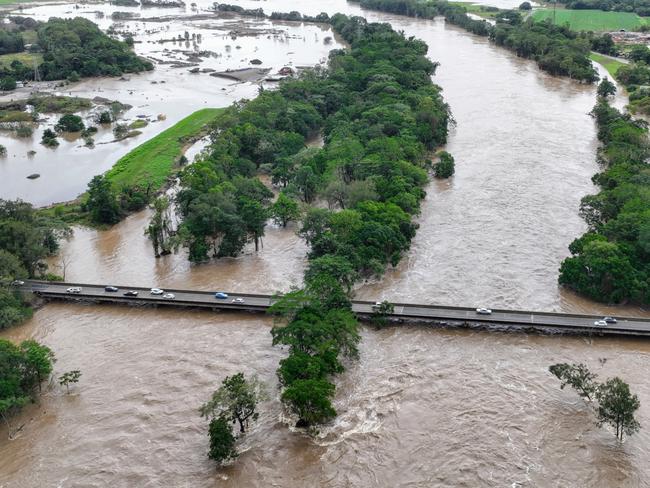 CAIRNS FLOOD BEFORE AND AFTER - The Barron River in Cairns, Far North Queensland, reached a record flood peak, with roads closed and homes flooded in the catchment area on Sunday, December 17. Flood waters lap at the Kamerunga bridge on the Western Road, and despite the bridge remaining open, road access was cut to the northern beaches of Cairns. The record flooding has been caused by ex Tropical Cyclone Jasper, which made landfall on December 13. Picture: Brendan Radke