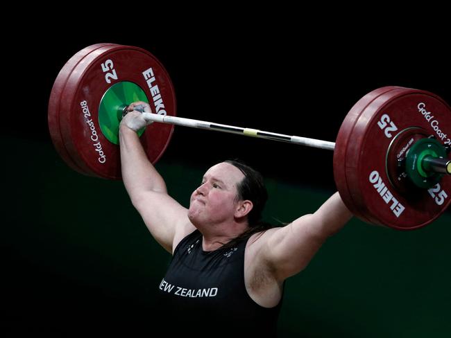 (FILES) This file photo taken on April 9, 2018 shows New Zealand's Laurel Hubbard competing during the women's +90kg weightlifting final at the 2018 Gold Coast Commonwealth Games in Gold Coast. - It was reported on May 6, 2021 that New Zealand weightlifter Laurel Hubbard was poised to become the first transgender athlete to compete at the Olympic Games in Tokyo under new qualification rules. (Photo by ADRIAN DENNIS / AFP)