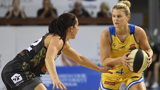 Shyla Heal looks to get past Mikaela Cocks of the Fire during the round 16 WNBL match between the Townsville Fire and the Bendigo Spirit. (Photo by Ian Hitchcock/Getty Images)