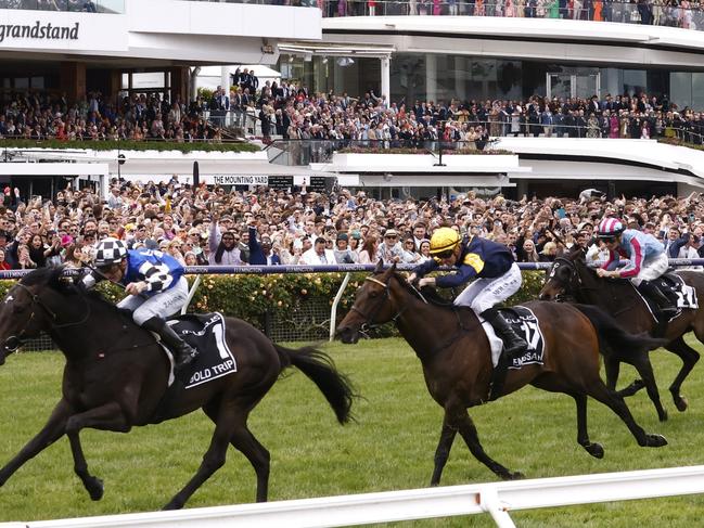 MELBOURNE, AUSTRALIA - NOVEMBER 01: Mark Zahra riding #1 Gold Trip leads Patrick Moloney riding #17 Emissary and Teo Nugent riding #22 High Emocean to win race seven, the Lexus Melbourne Cup during 2022 Melbourne Cup Day at Flemington Racecourse on November 01, 2022 in Melbourne, Australia. (Photo by Daniel Pockett/Getty Images)