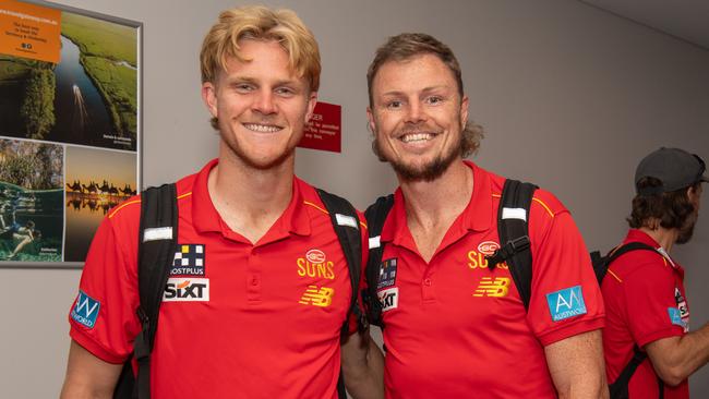 Bodhi Uwland and Nick Holman as the Gold Coast Suns land in Darwin for their AFL double header. Picture: Pema Tamang Pakhrin