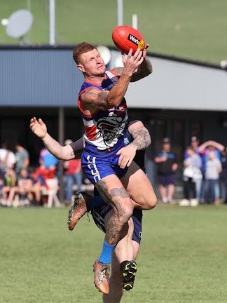 Bullioh captain Clayton Bosman leaps for a mark in the Upper Murray league grand final win over Cudgewa. Picture: Corryong Courier