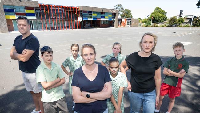 Paul Caon, Ryan, Mila, Deb Howe, Sadie, Sophie, Sharon Terkelsen and Andrew are upset the Catholic church pulled the pin on the deal. Picture: Tony Gough