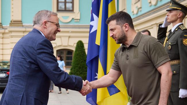 Ukrainian President Volodymyr Zelensky, right, and Australia's Prime Minister Anthony Albanese, left, shaking hands prior to their meeting in Kyiv. (Photo by UKRAINIAN PRESIDENTIAL PRESS SERVICE/AFP)