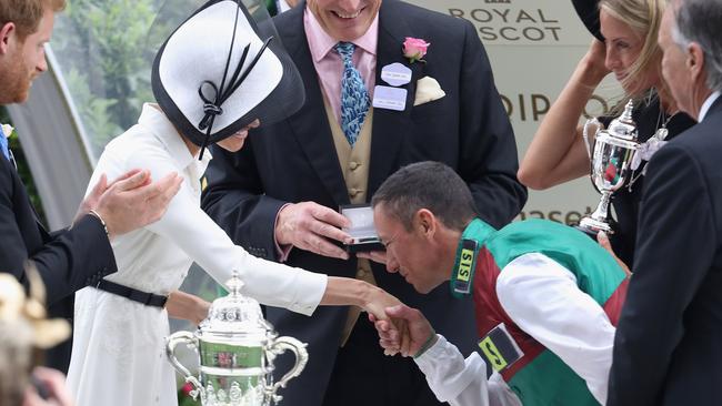 The jockey steals a kiss. Picture: Getty