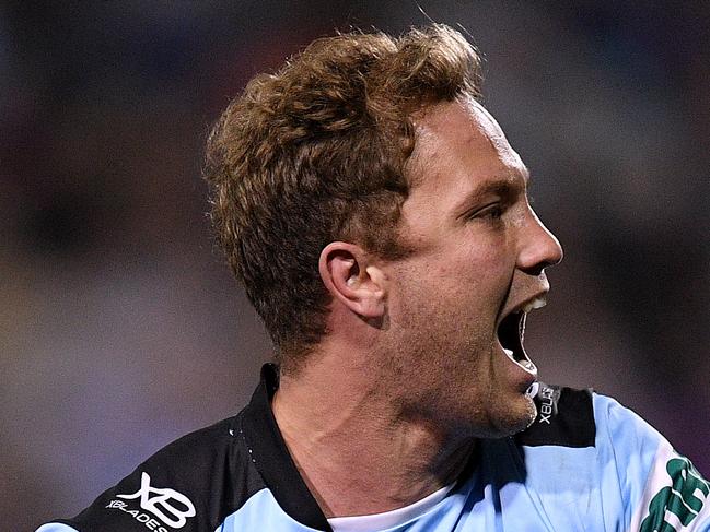 Matt Moylan of the Sharks celebrates after scoring a try during the Round 18 NRL match between the Penrith Panthers and the Cronulla-Sutherland Sharks at Panthers Stadium in Sydney, Friday, July 13, 2018. (AAP Image/Dan Himbrechts) NO ARCHIVING, EDITORIAL USE ONLY