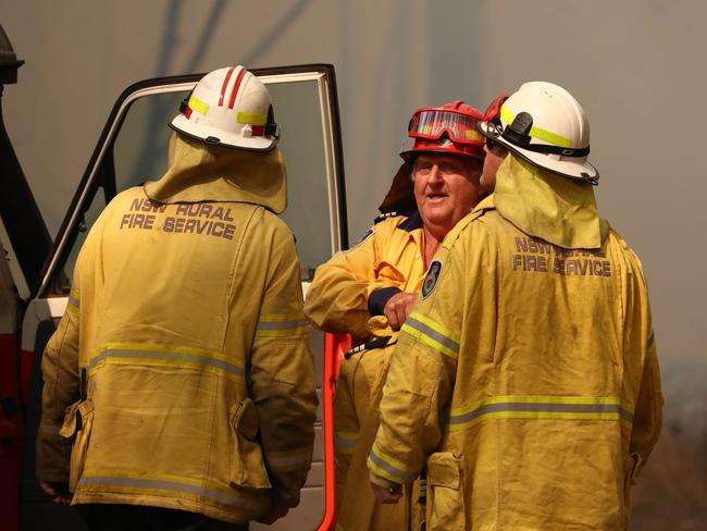Firefighters battle bushfires in Busbys Flat, northern NSW, Wednesday, October 9, 2019. (AAP Image/Jason O'Brien)