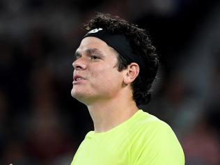 Milos Raonic chats with the chair umpire during his straight-sets defeat to Novak Djokovic.