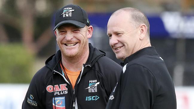 Michael Voss and Ken Hinkley share a laugh at training. Picture: Sarah Reed