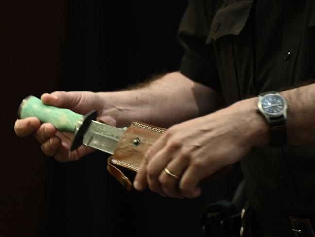 A Fairfax County Deputy Sheriff officer holds the knife that actor Heard gave to Johnny Depp in 2012. Picture: AFP