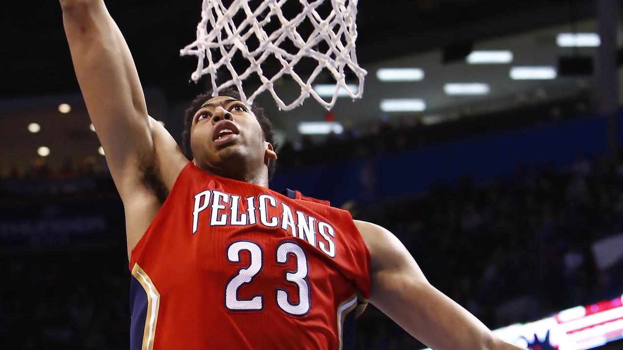 New Orleans Pelicans forward Anthony Davis (23) dunks against the Oklahoma City Thunder in the fourth quarter of an NBA basketball game in Oklahoma City, Sunday, Dec. 21, 2014. New Orleans won 101-99. (AP Photo/Alonzo Adams)