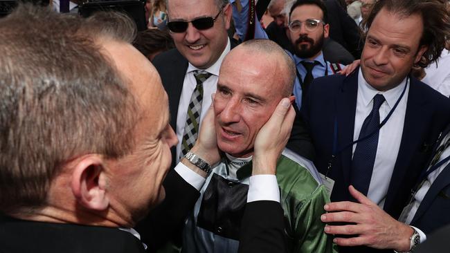 Trainer Chris Waller greets Glen Boss in the mounting yard. Picture: Getty Images