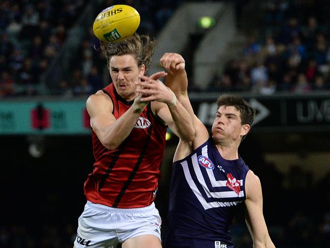 Sam Collins puts a heavy spoil on Joe Daniher. Photo by Daniel Wilkins.