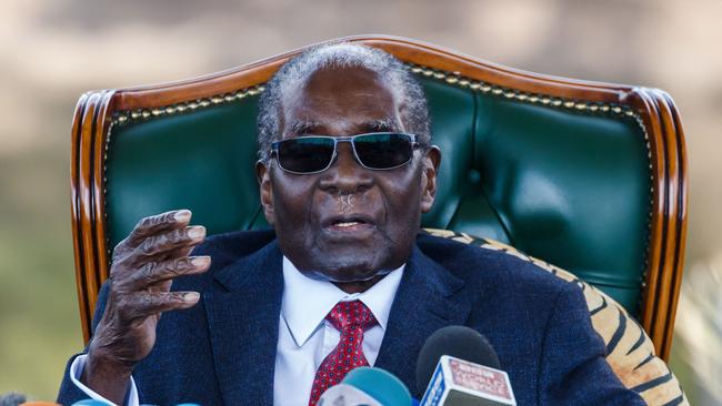 (FILES) In this file photo taken on July 29, 2018, former Zimbabwean President Robert Mugabe addresses media during a surprise press conference at his residence "Blue Roof " in Harare, on the eve of the country's first election since he was ousted from office last year. - Zimbabwe ex-president Mugabe has died in Singapore. (Photo by Jekesai NJIKIZANA / AFP)