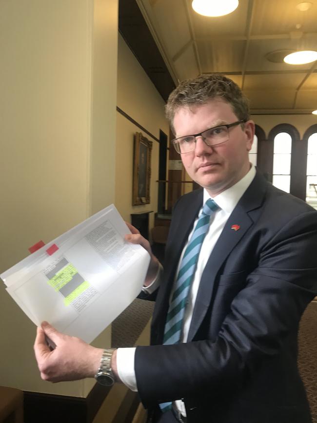 Opposition health spokesman Chris Picton with redacted portions of the audit of aged care homes.