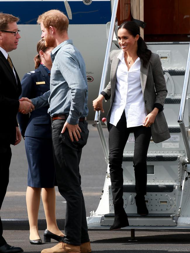 The Duke and Duchess of Sussex arrives with Prince Harry in Dubbo in 2018, wearing the Outland denim jeans. Picture: Toby Zerna