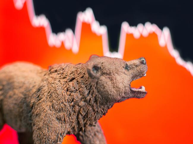 Bearish scenario in stock market with bear figure in front of red price drop chart.