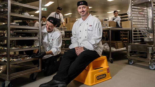 Josh McDonald and executive chef Gavin Robertson in the Adelaide Convention Centre kitchen, where up to 10,000 meals are being made a day for Adelaide’s most vulnerable. Picture: AAP / Morgan Sette