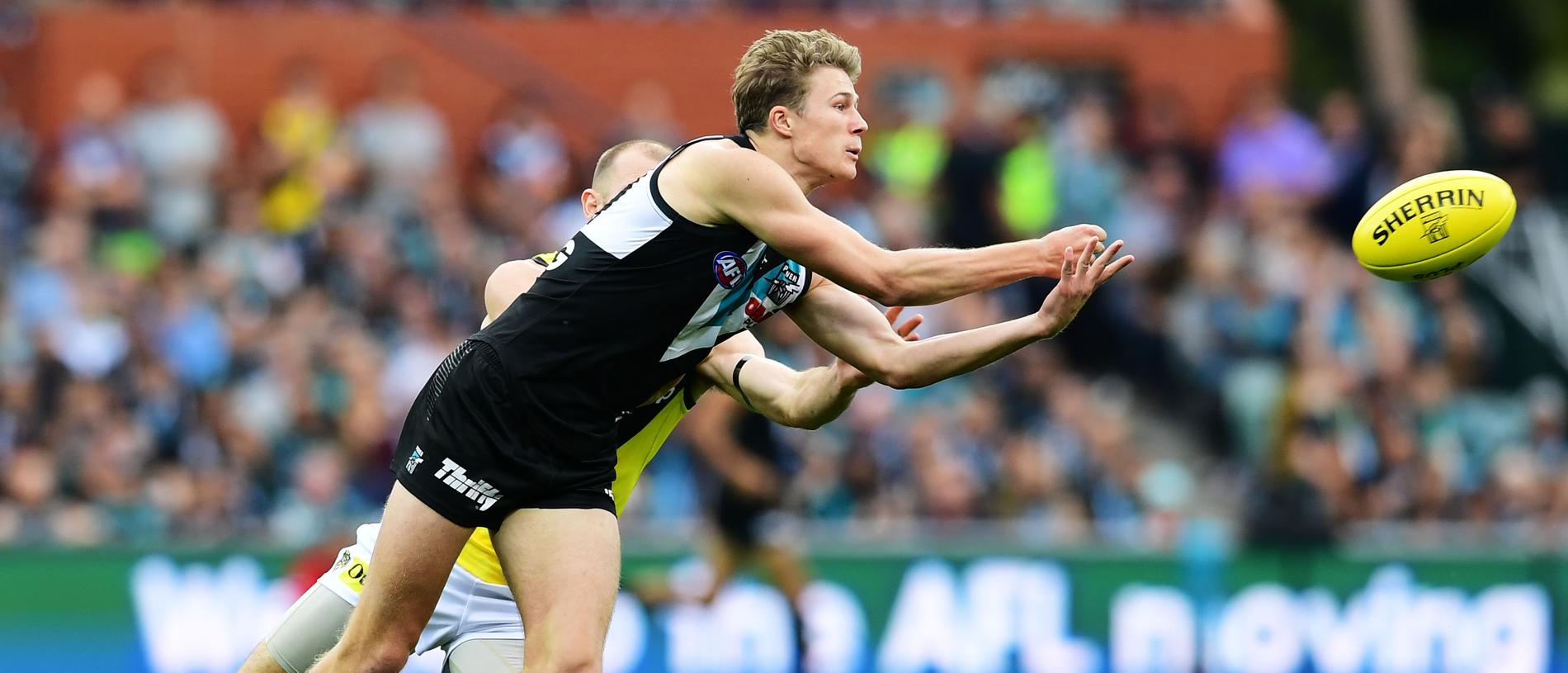 Xavier Duursma of Port Adelaide handballs under pressure at Adelaide Oval. Picture: Mark Brake/Getty Images