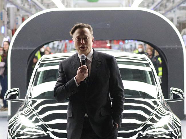 GRUENHEIDE, GERMANY - MARCH 22: Tesla CEO Elon Musk speaks during the official opening of the new Tesla electric car manufacturing plant on March 22, 2022 near Gruenheide, Germany. The new plant, officially called the Gigafactory Berlin-Brandenburg, is producing the Model Y as well as electric car batteries. (Photo by Christian Marquardt - Pool/Getty Images)