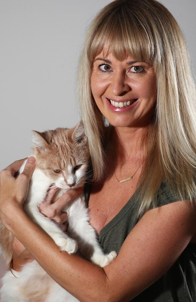 Chantay Logan pictured with her adopted cat Chloe at Burleigh Heads. Photograph: Jason O'Brien