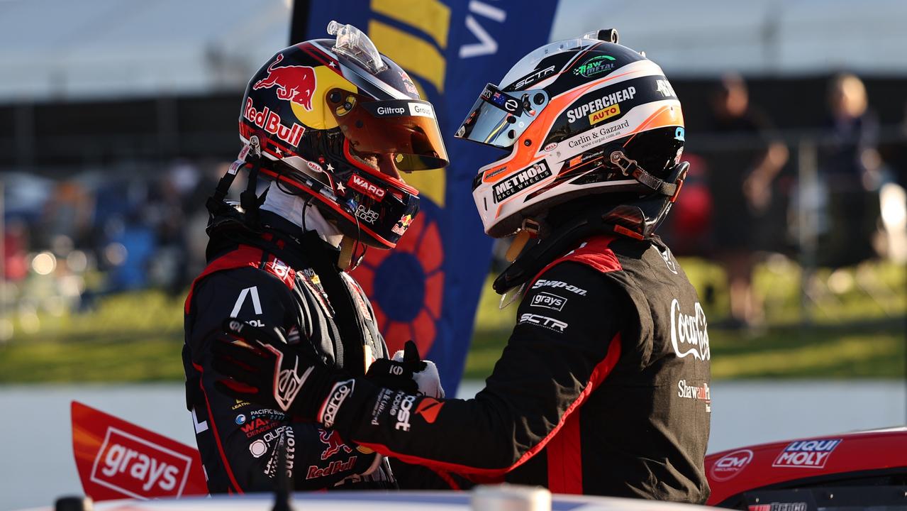 Shane van Gisbergen and Brodie Kostecki congratulate each other after a thrilling battle in Race 7 of the Supercars 2023 season at Wanneroo Raceway.