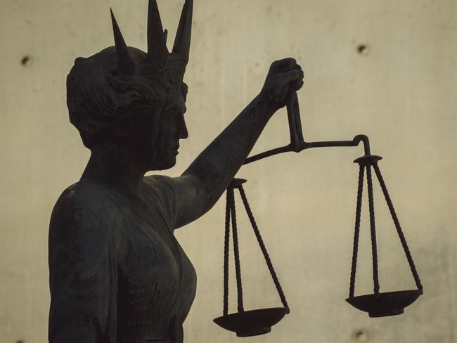 BRISBANE , AUSTRALIA - NewsWire Photos - BRISBANE , JUNE 24 2024: Generic photo of the scales of justice stature outside Brisbane Supreme Court in the Brisbane CBD. Picture: NewsWire / Glenn Campbell