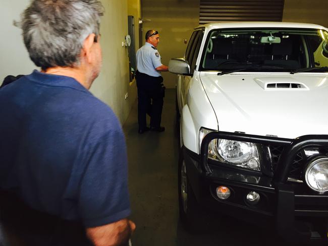 Gino Stocco leaves court with police. Picture: Peter Lorimer