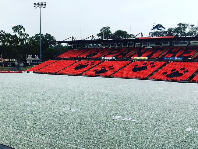 Penrith stadium covered by a white coating of hail.