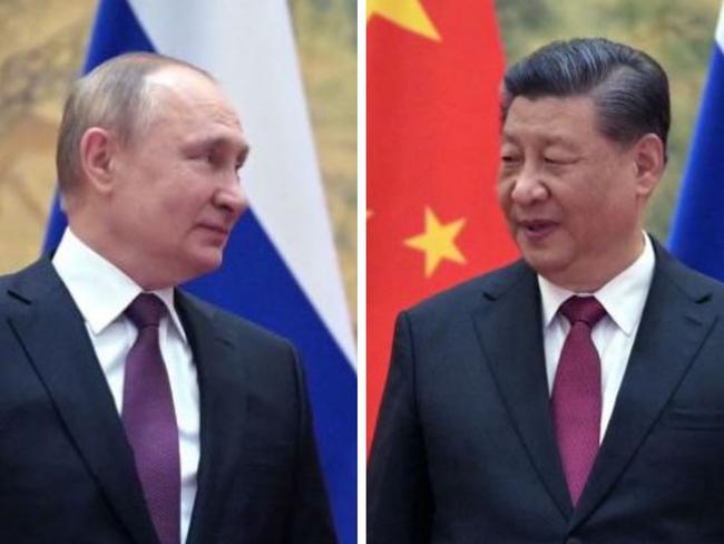 Russian President Vladimir Putin (L) and Chinese President Xi Jinping pose for a photograph during their meeting in Beijing, on February 4, 2022. (Photo by Alexei Druzhinin / Sputnik / AFP)