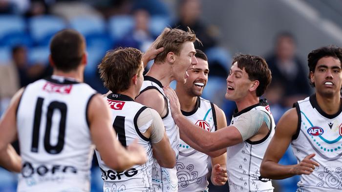 HOBART, AUSTRALIA - MAY 25: Todd Marshall of the Power celebrates a goal with teammates during the 2024 AFL Round 11 match between the North Melbourne Kangaroos and Yartapuulti (Port Adelaide) at Blundstone Arena on May 25, 2024 in Hobart, Australia. (Photo by Michael Willson/AFL Photos via Getty Images)
