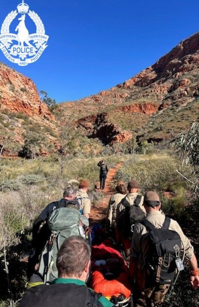 The 46-year-old female hiker was carried by stretcher by rescue teams for 3.5km. Image: NT Police.