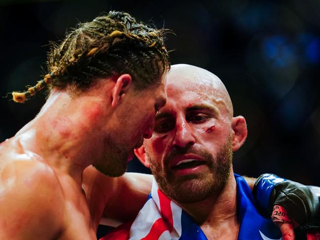 LAS VEGAS, NV - SEPTEMBER 25: Alexander Volkanovski of Australia and Brian Ortega hug after their Featherweight title fight during UFC 266 at T-Mobile Arena on September 25, 2021 in Las Vegas, Nevada. (Photo by Alex Bierens de Haan/Getty Images)