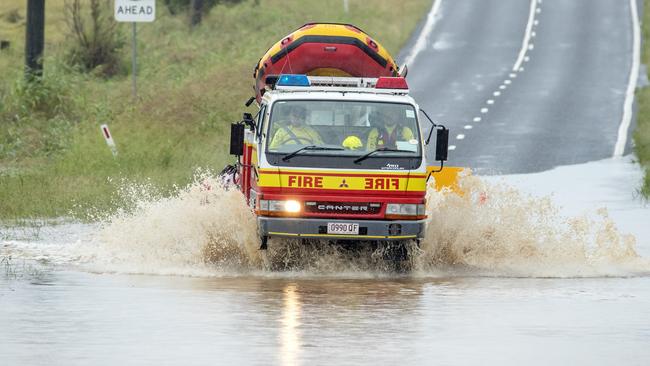 Queensland Fire and Emergency Services Swift Water Rescue leave Laidley to check a car in floodwaters at Theuerkaufs Road, Fairney View, near Fernvale, Friday, May 13, 2022 – Picture: Richard Walker