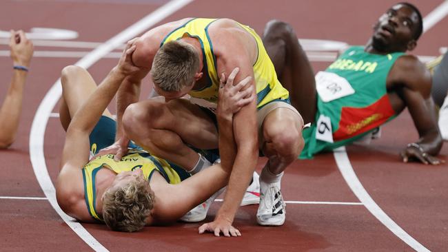 Moloney (ground) and Dubler share a special moment at the Tokyo Olympics. Picture: Alex Coppel