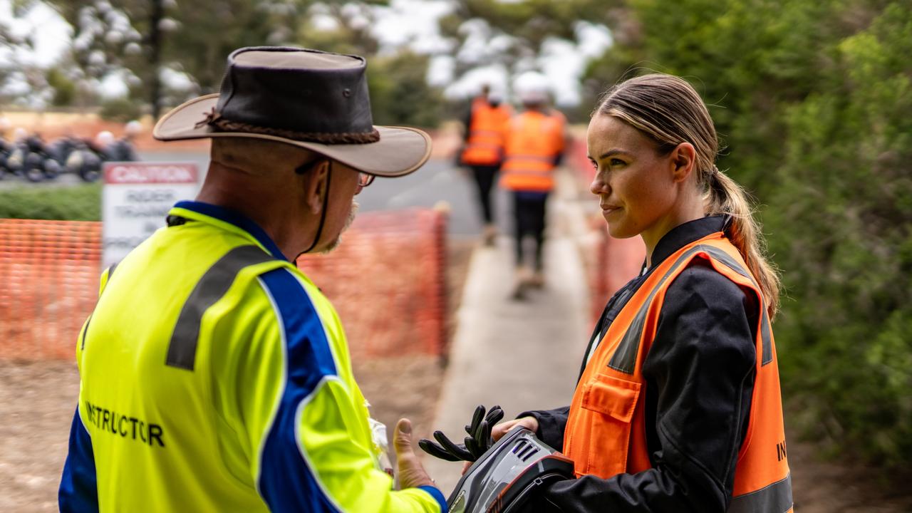 Stay Upright Rider Training instructor Ryland and reporter Danielle Collis discussing the importance of correct motorcycle attire. Picture: Peter Cain, Stay Upright Rider Training