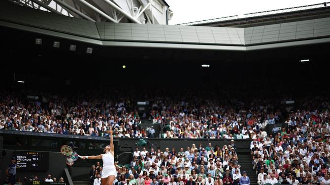 Italy's Jasmine Paolini serves against Czech Republic's Barbora Krejcikova during their women's singles final tennis match on the thirteenth day of the 2024 Wimbledon Championships at The All England Lawn Tennis and Croquet Club in Wimbledon, southwest London, on July 13, 2024. (Photo by HENRY NICHOLLS / AFP) / RESTRICTED TO EDITORIAL USE