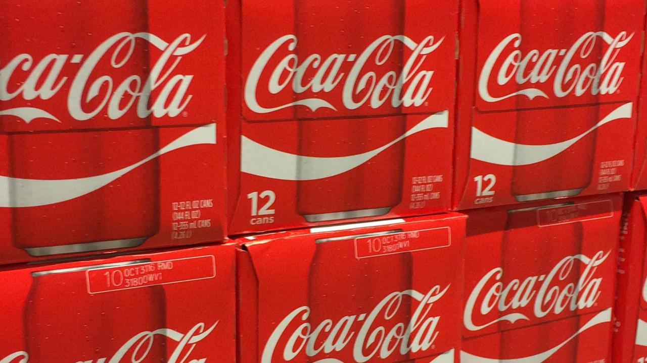 Aussies spend the same amount on Coca-Cola throughout the year as they do on managing their tax affairs. Picture Karen Bleier/AFP