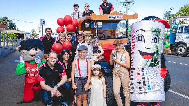 ALL ABOARD: The Gympie Times crew ready to head down Mary St in Rob and Carol White&#39;s historic truck. Picture: LEEROY TODD