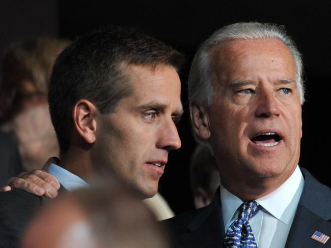 Mr Biden attended a memorial service for his late son Beau Biden (pictured with his father in 2008) earlier on Friday. Picture: Paul J Richards / AFP
