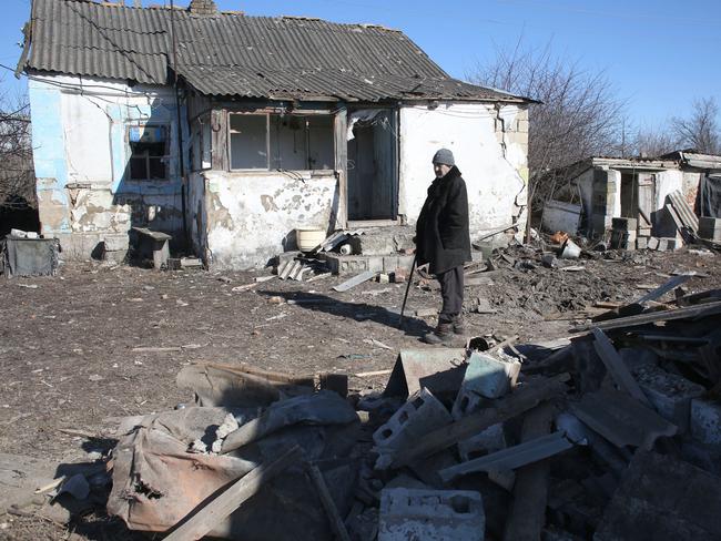 A local resident inspects his house, damaged after a shelling in Novohnativka village, Donetsk region, not far from position of Ukrainian Military Forces on the front line with Russia backed separatists. Picture: AFP