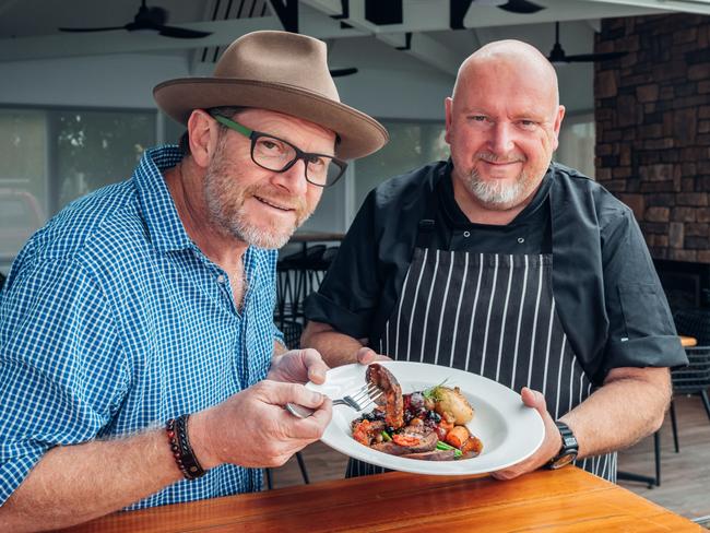 Gippsland Wild Foods owner Dominic Britten with Pier 70 chef Ian Pearson  who has plated up some venison. Pictured are a venison eye fillet, venison ragu with locally sourced ingredients and braised venison with poached eagle point pears. Pictures: Laura Ferguson