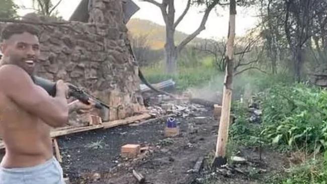 Storm player Josh Addo-Carr with a gun while camping on Latrell Mitchell’s property. Picture: Instagram